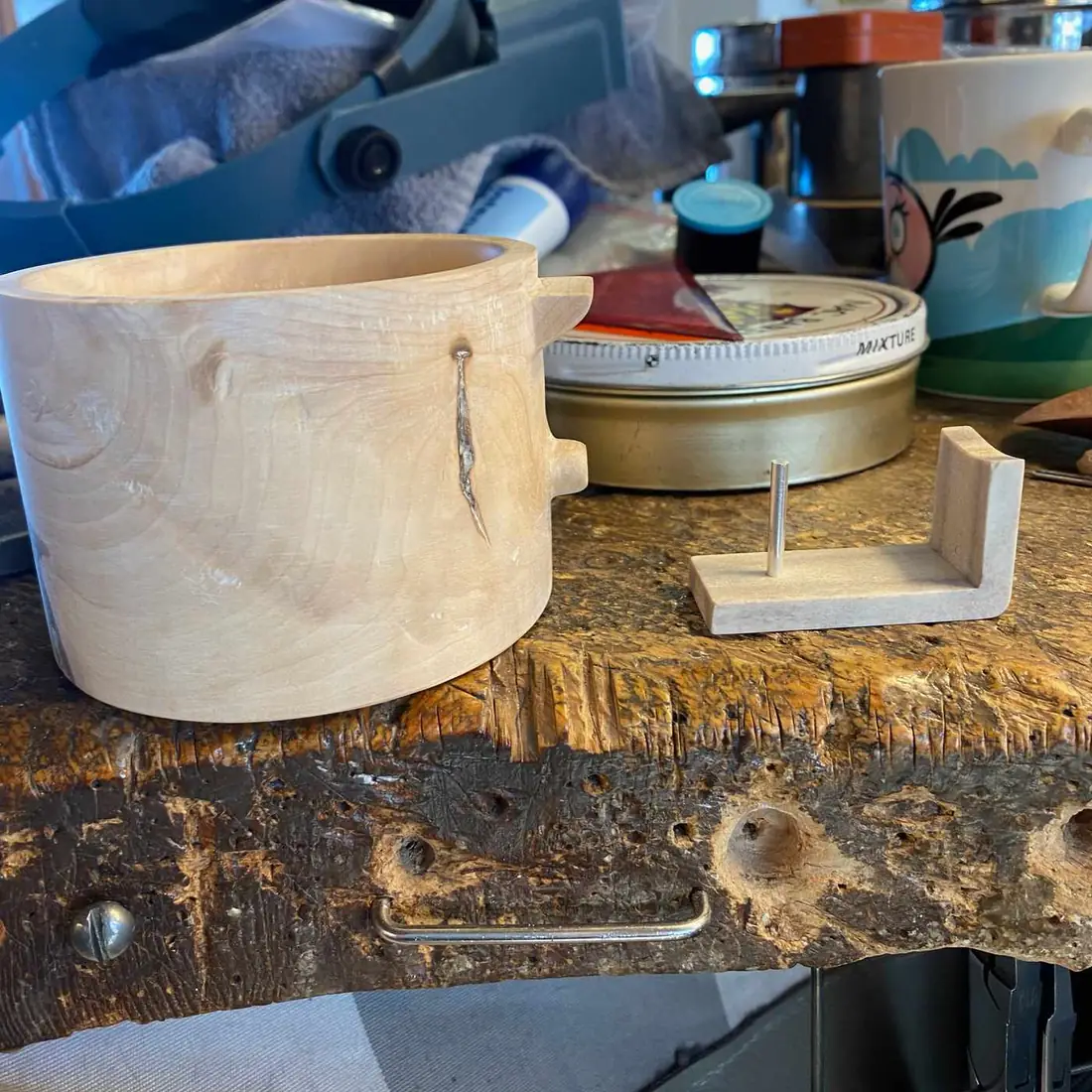 Finished cup body with silver crack inlay, next to the handle mount