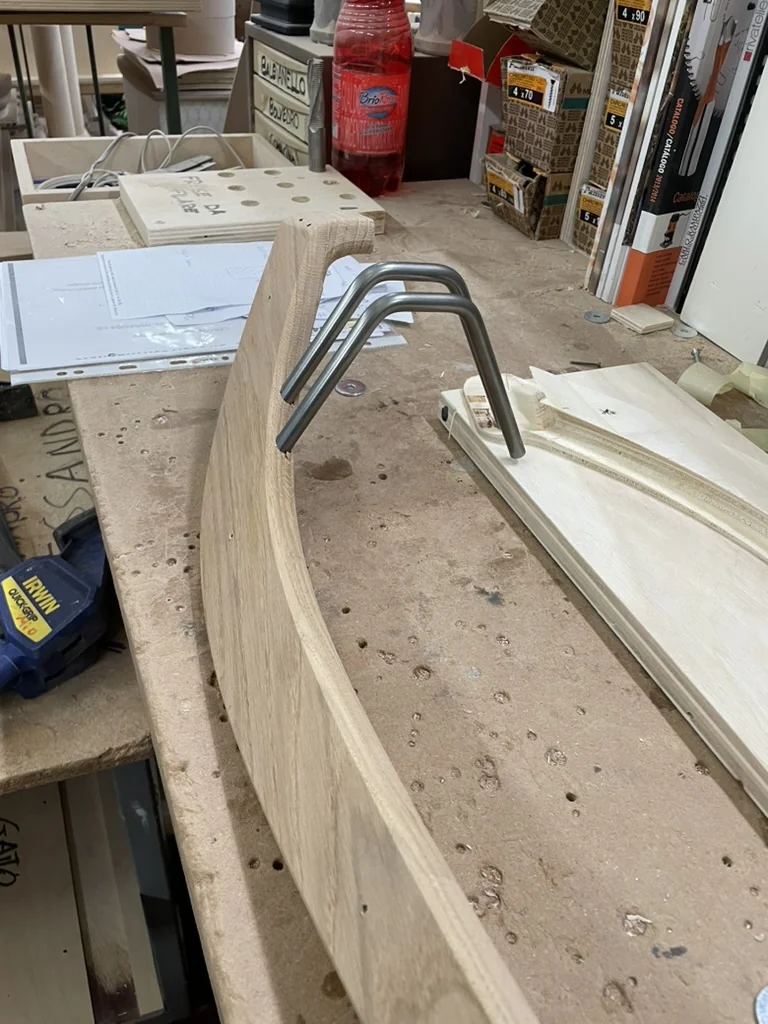 Wood leg piece with the metal pin fitting test-fitted