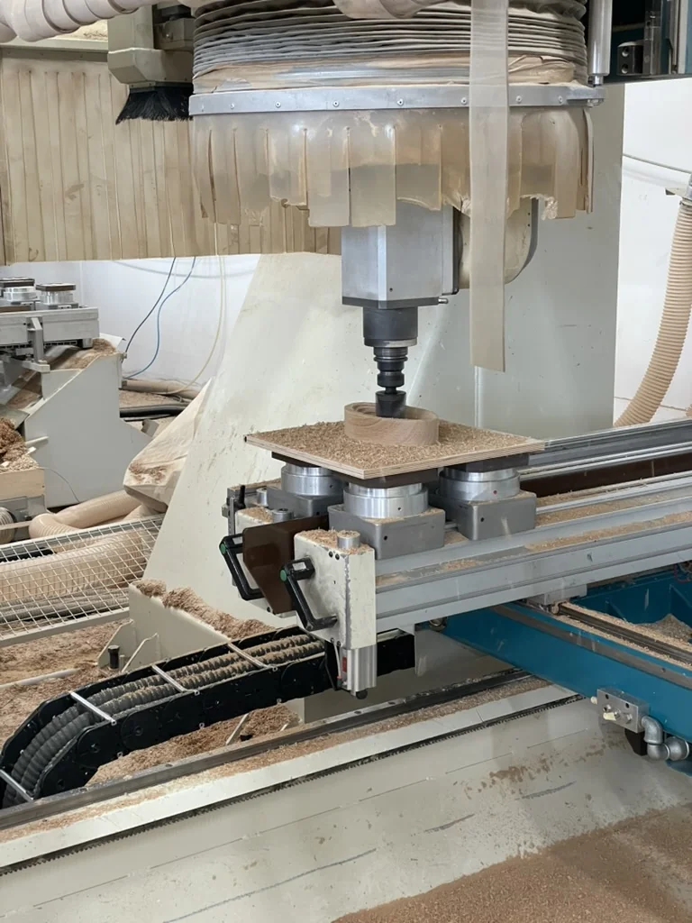CNC machine shaping the oval bowl piece
