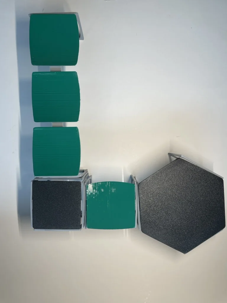 Top view of the 3D printed Kart seat models showing the paint damage on the green ones